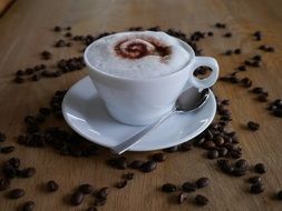 cappuccino and coffee beans