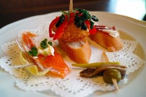 Pintxos dish is on the plate in restaurant