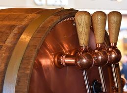 wooden barrel with brass taps