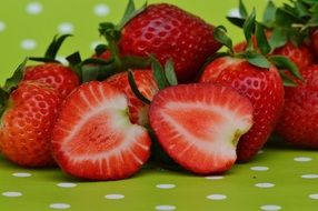 Cut strawberries on tablecloths close
