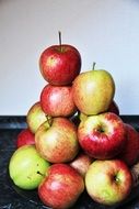 a stack of red-yellow apples