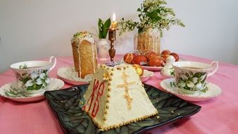 curd Easter cake with a candle on the table