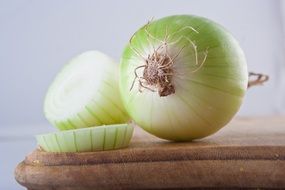 Green and white onion on the chopping board