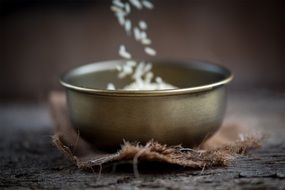 sifting rice in a bowl