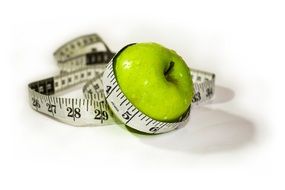 Apple and measuring tape