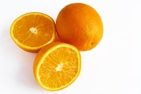 whole and cut oranges