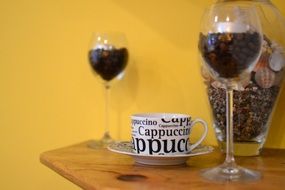 Cappuccino Mug and grains of coffee