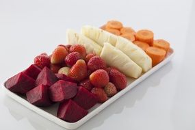 fruits and vegetables on one plate