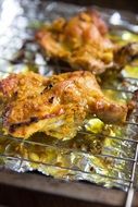 grilled chicken with spices on the wire rack