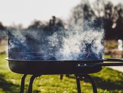 smoke above the grill outdoor