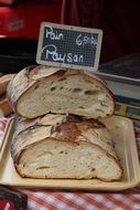 cut loaf of bread with price on display