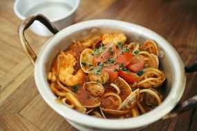 pasta with sauce in a saucepan