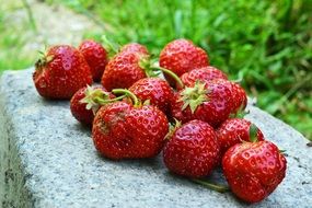 strawberries lie on a stone