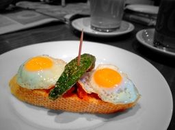 sandwich with fried eggs and avocado