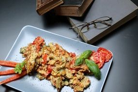 Scrambled eggs with vegetables on a plate