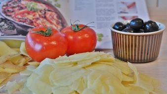 potatoes next to tomatoes on the table