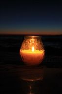 lighting candle on the beach