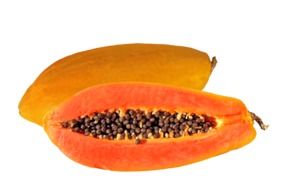 juicy papaya in the cut at white background