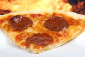 piece of American Baked pepperoni pizza