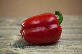 red sweet Pepper on wooden table