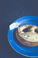 pretzel on a blue plate