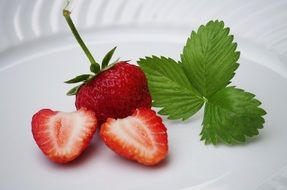 strawberries and mint on a white plate