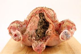 stuffed chicken on wooden board