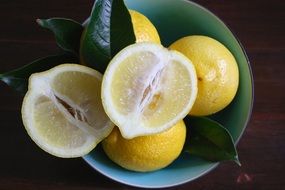 fresh Lemons with leaves in bowl