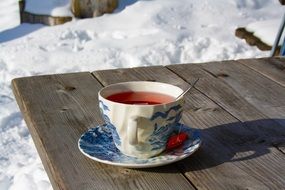 cup with tea on a table on the street