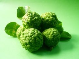 Bergamot Fruits Isolated on green surface
