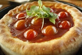 tomato topping on pizza close up