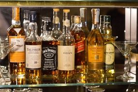 elite whiskey on a glass shelf