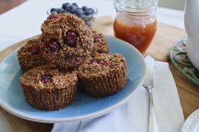 Brown chocolate muffins on the blue plate