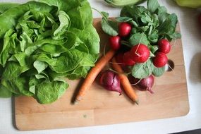 fresh healthy vegetables on cutting desk