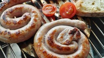 grilling sausages with tomatoes and bread