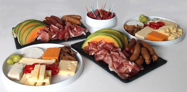 meat and cheese plates on the table
