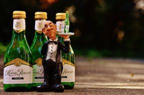 funny Waiter figurine and bottles with wine