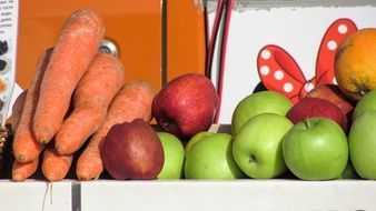 Carrots,green and red apples and orange