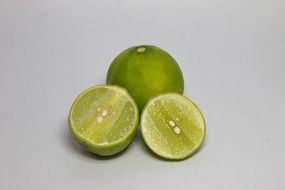 Sliced green lime on the white background