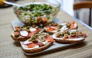 Breakfast Salad and sandwiches with salmon