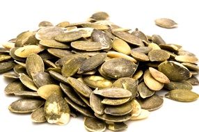 pumpkin seeds on a white surface