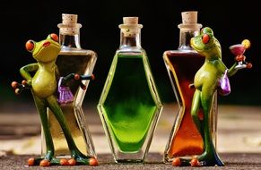 Frogs figurine and bottles different forms