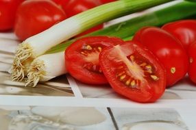 Bisected Tomatoes and Spring Onions Vegetables