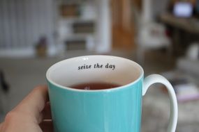 cup of tea in hand