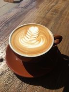 cup with latte on a saucer