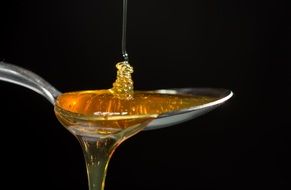 sweet honey poured from a spoon