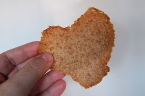 heart shaped sandwich Bread in hand