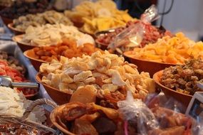 Different kind of dried fruits in the bowls