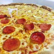 Pizza with cheese and sausages