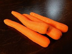 carrots on a black plate